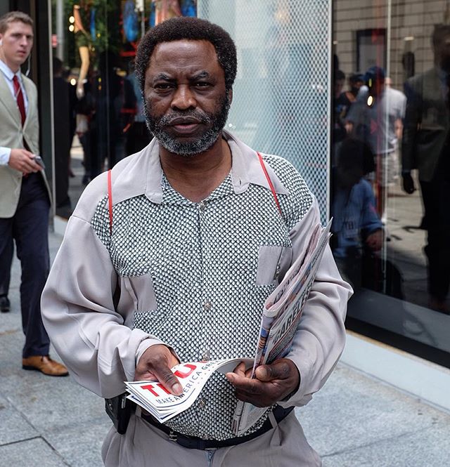 Deeply Pleated with his fish-scale or python like front of shirt!