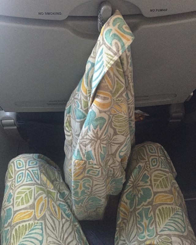 Because any respectable fella travels in a suit