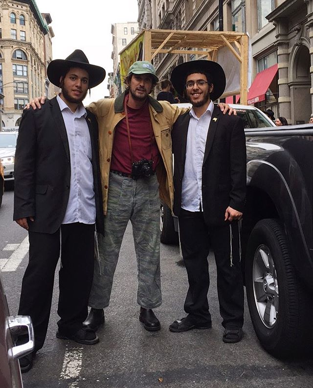cruising round town in this boat of a cadillac (color of my t) and had to pull over for a quick mitzvah! (shaking the lullov (palm branch) and esrog (citrus fruit from italy/israel) (the most beautiful smell of any scent)! always time for a mitzvah!